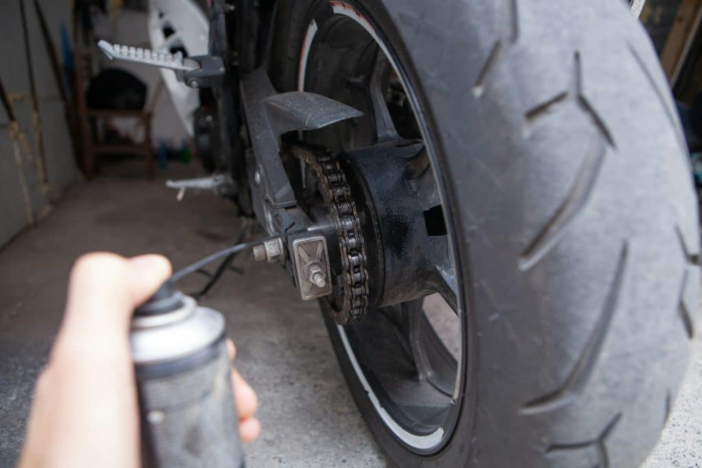 Lubricating a motorcycle chain as part of a routine pre-ride check